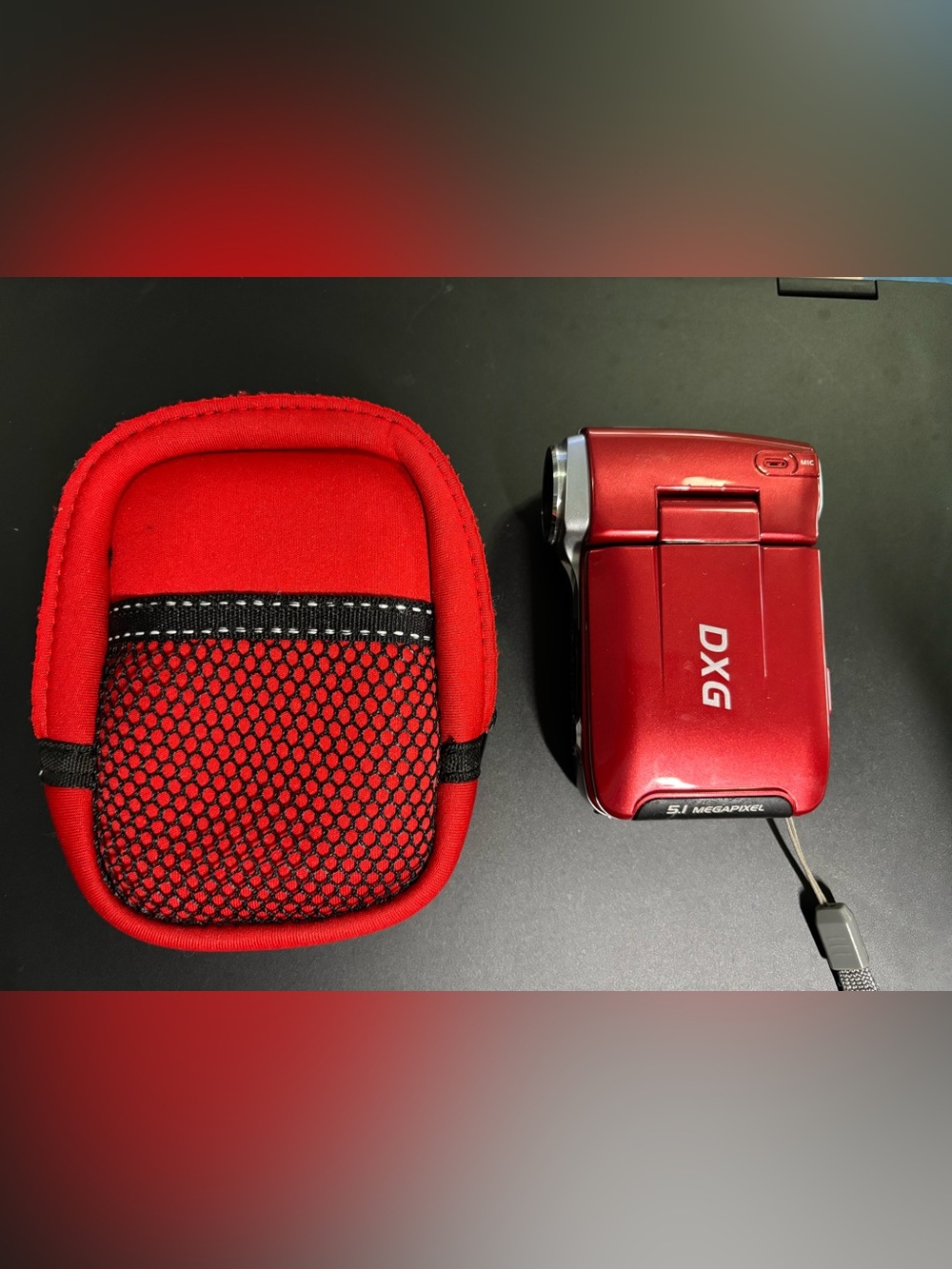 Vintage DXG-565V digital camcorder in red.